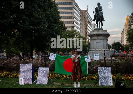 Amad Mahbub, a Bangladeshi artist is giving a speech while the Bangladeshi community is holding a candlelight vigil on August 11, 2024, in McPherson Square, Washington DC, USA, to pay tribute to the martyred students, who are dying in the quota movement in Bangladesh. After mass killings by the law enforcement agency, the quota movement turned into an anti-government protest that led to an uprising that ended the 15-year authoritarian rule of Sheikh Hasina. Nobel laureate Muhammad Yunus and his newly named interim government set out on August 9th. Credit: Aashish Kiphayet/Alamy Live News Stock Photo