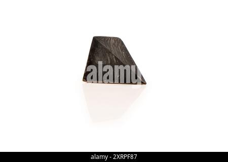 Chocolate candies in the form of precious stones, with marble texture, isolated on a white background. Stock Photo