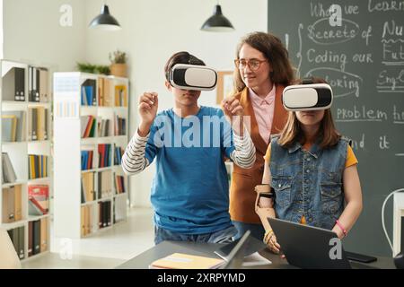 Two Children using VR in School Stock Photo