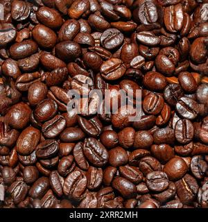 Detailed seamless pattern featuring roasted coffee beans. Perfect background for coffee-related designs and advertisements. Stock Photo