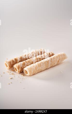 Crispy and delicious coconut crispy egg roll snack close up on white background Stock Photo