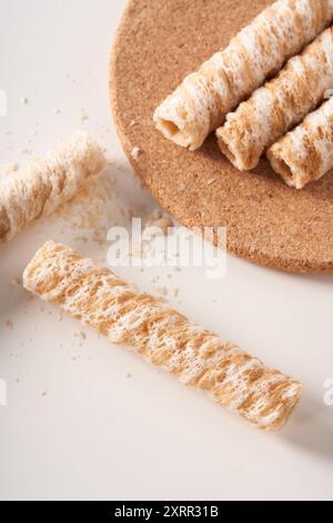 Crispy and delicious coconut crispy egg roll snack close up on white background Stock Photo