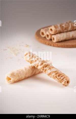 Crispy and delicious coconut crispy egg roll snack close up on white background Stock Photo