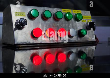 Old mechanical switchboard with red and green buttons Stock Photo