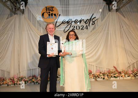 NEW DELHI, INDIA - JULY 28: (EDITOR'S NOTE: This is an exclusive image of Hindustan Times/Sipa USA) Philanthropist Kiran Nadar received an award from High Commissioner of Australia Philip Green during the HT City Legends 2024 awards hosted by HT City marking its 25th birthday, at the Taj Palace, Chanakyapuri on July 28, 2024 in New Delhi, India. This sit-down soiree was a tribute to luminaries from diverse fields who have left an indelible mark on their professions. (Photo by Manoj Verma/Hindustan Times/Sipa USA ) Stock Photo