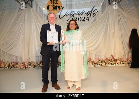 NEW DELHI, INDIA - JULY 28: (EDITOR'S NOTE: This is an exclusive image of Hindustan Times/Sipa USA) Philanthropist Kiran Nadar received an award from High Commissioner of Australia Philip Green during the HT City Legends 2024 awards hosted by HT City marking its 25th birthday, at the Taj Palace, Chanakyapuri on July 28, 2024 in New Delhi, India. This sit-down soiree was a tribute to luminaries from diverse fields who have left an indelible mark on their professions. (Photo by Manoj Verma/Hindustan Times/Sipa USA ) Stock Photo