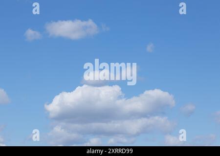 Clear Blue Sky with Fluffy White Clouds Stock Photo
