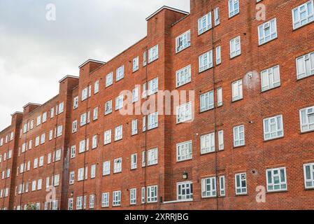 Facade of red brick block of flats around hackney in London Stock Photo