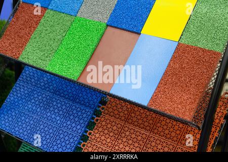 Samples of various multi-colored artificial turf for sports fields. Industry Stock Photo