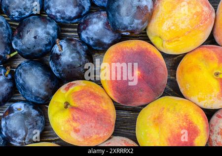 Fresh Juicy Fruits On A Wooden Surface, Peaches, Plums Stock Photo