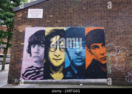 A General view (GV) of The Fab Four Mural on Watkinson Street created by Liverpool-based street artist John Culshaw, in the Baltic Triangle in Liverpo Stock Photo