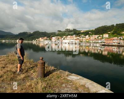 Cool middle aged man hiking and contemplating view in Northern Spain Stock Photo