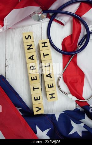 Veterans Health text messege with USA flag on wooden background Stock Photo