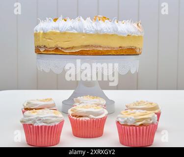lemon pie dessert for birthday or celebration On top of the cake, you see peaks of white meringue, decorated with what appears to be gold foil. In the Stock Photo