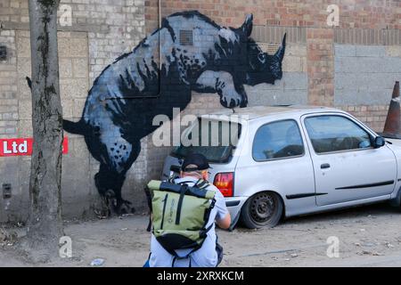 Charlton, London, UK. 12th Aug 2024. A Rhino artwork by Banksy in Charlton, London. Credit: Matthew Chattle/Alamy Live News Stock Photo