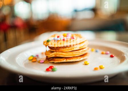 Glossy Pancakes with Colorful Chocolate Lentils as Topping Stock Photo