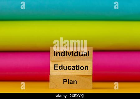 individual education plan. IEP symbol, Business concept. Words written on wooden blocks. Multicolored background, copy space Stock Photo