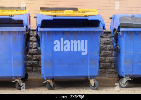 Garbage bins in city. Dustbins being full with garbage. Garbage is pile lots dump. Stock Photo