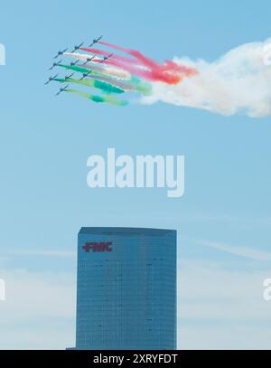 The Italian Air Force's Frecce Tricolori (Tricolor Arrows) aerobatic demonstration team releases colored smoke as it flies over Philadelphia. Stock Photo