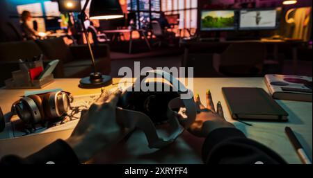 POV of a Person Picking Up a Virtual Reality Headset in Creative Office. Mock Up for Inserting Your Own VFX Virtual Reality 3D Universe, Digital Office Interface, Social Platform Stock Photo