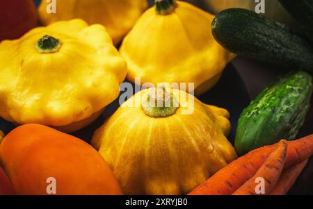 Autumn vegetables background. Organic autumn agricultural vegetables, mushrooms. Various vegetarian ingredients for preparing dinner on black kitchen Stock Photo