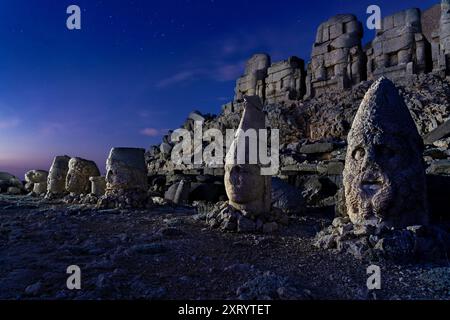 Giant statue heads built in the 1st century BC on the Nemrut Mountain, at the twilight, Adiyaman, Turkey. Stock Photo