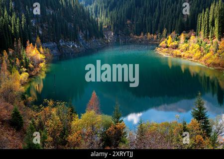 View over the Kaindy Lake in autumn, Kazakhstan Stock Photo