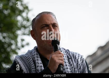 London, UK. 12 August, 2024. Ambassador Husam Zomlot, Head of the Palestinian Mission to the United Kingdom, addresses Palestine supporters protesting in Whitehall, London, opposite UK Prime Minister Keir Starmer's residence, following Israeli bombing of al-Tabin school in Gaza, killing dozens and injuring many more. The school was sheltering refugees fleeing earlier Israeli attacks. Organised by the Palestine Solidarity Campaign, Stop the War Coalition and Friends of Al Aqsa, the rally called for the UK to stop arming Israel and for an immediate ceasefire. Credit: Ron Fassbender/Alamy Live Ne Stock Photo