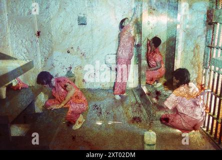 ©1988 Female inmates at the Travis County jail in Austin work to clean up their sleeping area.  ©Bob Daemmrich Stock Photo