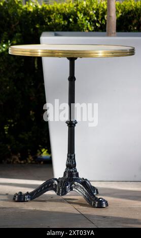 Vintage Wrought Iron Bistro Table and Chairs in Dramatic Shadow Stock