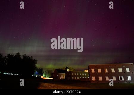 British Army reservists from the 3rd Battalion, Royal Anglian Regiment, known as “The Steelbacks,” conduct a simulated company-level urban operations night attack during Exercise Northern Strike 24-2 at the Combined Armed Collective Training Facility, Camp Grayling, Michigan, Aug. 12, 2024. Northern Strike 24-2, one of the Department of Defense's largest reserve component readiness exercises, is scheduled to take place at Michigan's National All Domain Warfighting Center (NADWC) from August 3-17, 2024. Over 6,300 participants from 32 states and territories and several international participant Stock Photo