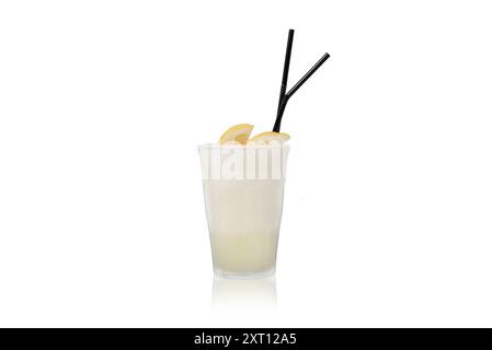 Refreshing lemon cocktail in a tall glass with a frosted appearance, accompanied by two black straws and a lemon wedge garnish, isolated on a white ba Stock Photo