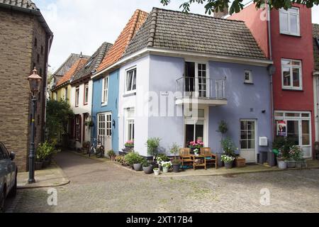 Dutch street called Markt with colorful houses with flower pots. Summer, August, Doesburg, Netherlands Stock Photo