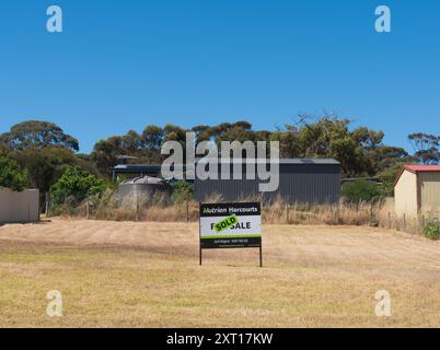 Real estate sign indicates successful sale on vacant property in South Terrace, Penneshaw on Kangaroo Island, Australia. Stock Photo