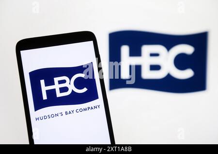 Ukraine. 12th Aug, 2024. In this photo illustration, a Hudson's Bay Company (HBC) logo is seen on a smartphone and on a pc screen. Credit: SOPA Images Limited/Alamy Live News Stock Photo