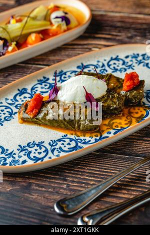 Turkish Dolma (sarma) stuffed vine leaves from Turkish traditional cuisine. Turkish name Yaprak Sarmasi Stock Photo