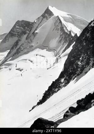 The photograph captures the snow-covered Großes Möseler in the Zillertal Alps, a mountain range in the Austrian Tyrol. This region became part of Nazi Germany after the Anschluss in 1938. Images like this were often used in Nazi propaganda to highlight the natural beauty and grandeur of the territories under the Third Reich, promoting a sense of pride and unity among the German populace during World War II. Stock Photo