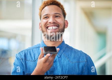 Happy, businessman and talking on speaker with phone for audio message, recording or communication at office. Man or employee with smile on mobile Stock Photo