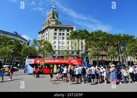 City tour buses depart from Plaça de Catalunya in Barcelona, Spain. Stock Photo