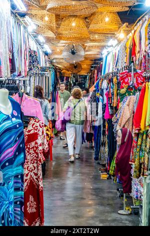 Penang Bazaar is an indoor market on Penang Road in Penang, Malaysia. Narrow passageways between stalls which mainly sell clothes and souvenirs Stock Photo