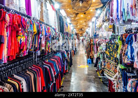 Penang Bazaar is an indoor market on Penang Road in Penang, Malaysia. Narrow passageways between stalls which mainly sell clothes and souvenirs Stock Photo