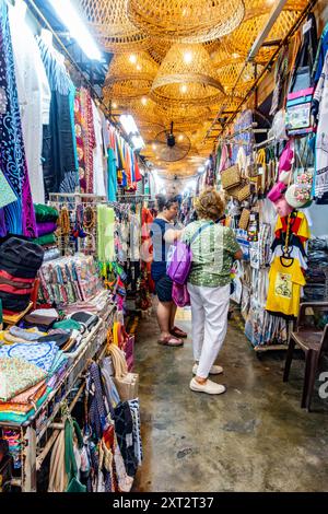 Penang Bazaar is an indoor market on Penang Road in Penang, Malaysia. Narrow passageways between stalls which mainly sell clothes and souvenirs Stock Photo