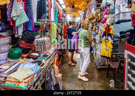 Penang Bazaar is an indoor market on Penang Road in Penang, Malaysia. Narrow passageways between stalls which mainly sell clothes and souvenirs Stock Photo