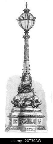 Lamp on the Thames Embankment [in London], 1870. A design '...which at present exists only in plaster, but [is] painted to imitate bronze...[It] occupies an important position, where it remains to await the critical judgment of men of taste. It is designed by Mr. G. Vulliamy, chief architect to the Metropolitan Board of Works, who has cleverly availed himself, in its figures of the dolphins, of the fine examples he had seen at Rome, in the ornamental fountains of Monte Pincio, and in other parts of that city. The execution of this design, according to the estimates of the Coalbrookdale Company Stock Photo