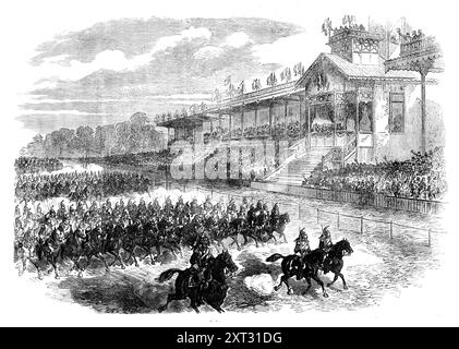 Review of the French Army at Longchamps [sic], Bois de Boulogne, 1871. View of '...he grand review of the French army...at the Hippodrome or Racecourse of Longchamps...The principal box in the Grand Stand, which was used formerly to be occupied by the Emperor Napoleon and his family, now contained M. Thiers and the Ministers of the Provisional Government...some wearing their badges of the Legion of Honour. On one hand of M. Thiers was a compartment filled with members of the Versailles National Assembly; on the other were the foreign ministers, and beyond these a number of ladies; the remainin Stock Photo