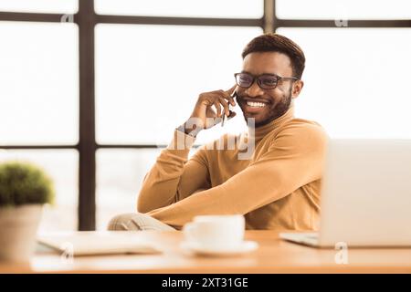 Happy afro student talking on the phone Stock Photo