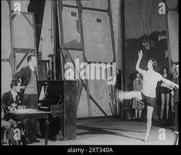 A Female Civilian Performing a Dance Routine With Lots of High Kicks and the a Handstand in a Studio, 1920s. From &quot;Time To Remember - On Stage In The Twenties&quot;, 1927 (Reel 1); a look behind the scenes of the theatre during the 1920's. Stock Photo