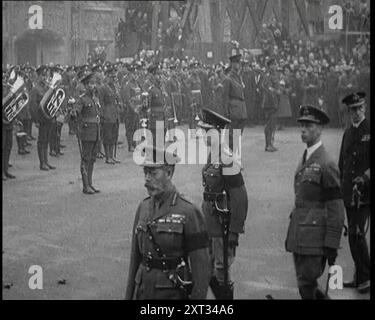 King George V, Edward, Prince of Wales, and Prince Albert Walking in Procession During Armistice Day, 1920. 'On Armistice Day in London, the great marched with the gun-carriage, with the poor shattered body, chosen at random, unrecognised, maybe unrecognisable. In Whitehall, King George V, his sons and his ministers, paid their respects in one more unveiling, this time of a memorial to one mighty host to be remembered - the Cenotaph...Poor broken warrior, whatever he was in life, in death he was the greatest of them all'. From &quot;Time To Remember - The Plunge Into Peace&quot;, 1920 (Reel 1) Stock Photo