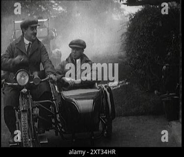 A Motorcycle and Sidecar Pulling up at a Petrol Station for a Refuelling, 1920. 'The first petrol station in the country was opened by the Automobile Association, and from its first day did a brisk trade...the days of the horse on the roads of Britain were well and truly numbered. There was a new spirit ahead, one called gasoline, with all its attendant smells, smoke, honk and clatter'. From &quot;Time To Remember - The Plunge Into Peace&quot;, 1920 (Reel 4); events of 1920 - weddings, women's rights, industrial unrest and problems in Ireland Stock Photo