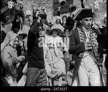 Scene from the Feature Film 'Nelson': Crowds of Actors in Period Costume Lining the Streets Enthusiastically Greeting Nelson, 1920s. 'A burst of British productions on the theme of 'empire'. &quot;Nelson&quot;, with Cedric Hardwicke in the title role. The great admiral leaves on the last voyage, which will end in his death, and the victory at Trafalgar'. From &quot;Time To Remember - Came The Dawn&quot;, 1925 (Reel 3); peek at the British Film Industry of the 1920s - clips from great silent films and newsreels. Stock Photo